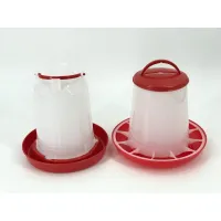 Red and white poultry water drinker and grain feeder displayed side by side