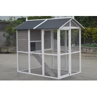Large white-framed chicken coop with grey nesting house, wire enclosure, ramp and dark pitched roof
