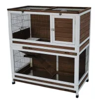 Two-level white and brown wooden animal hutch with wire doors, ramps, shelves and hinged roof
