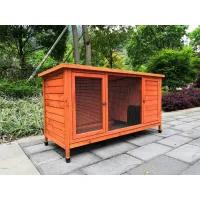 Large orange-stained wooden animal hutch with two wire-mesh front doors and raised legs