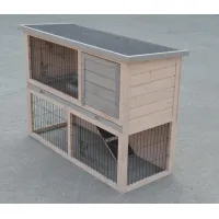 Two-level wooden animal hutch with wire doors, enclosed upper compartment, tray fronts, and a dark roof
