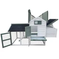 White and sage-green wooden chicken coop with wire run, open doors, hinged roofs, and pull-out tray