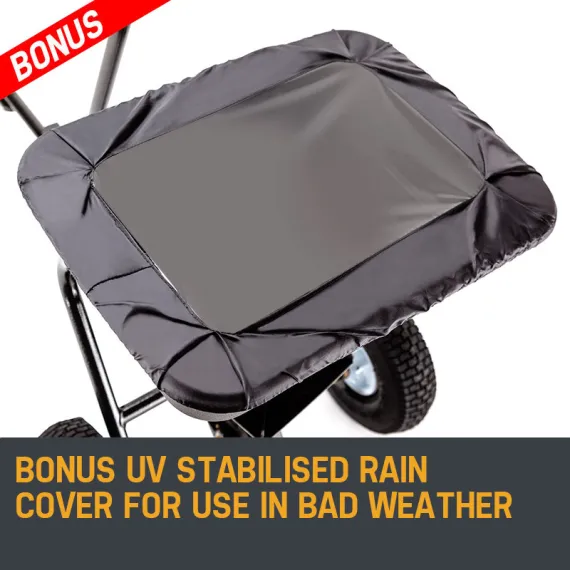 Black fabric cover fitted over a wheeled spreader hopper, shown from above