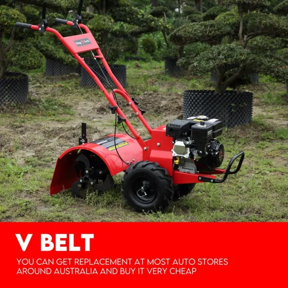 Red petrol rotary tiller with handlebars, engine, wheels and covered blades standing in a garden