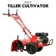 Red petrol rotary tiller with black engine, handlebars, large tires, and covered front tines on white