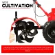 Side view of black rotary tines beneath a red protective cover beside the tiller's large tire
